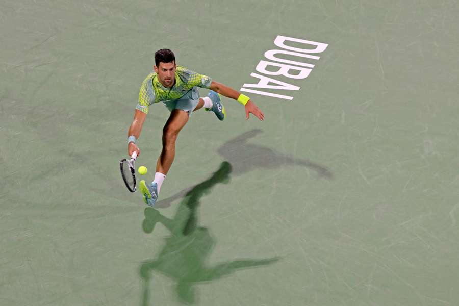 Serbia's Novak Djokovic hits a return against Poland's Hubert Hurkacz