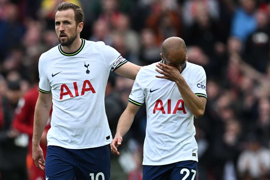 Tottenham Hotspur's English striker Harry Kane (L) consoles Tottenham Hotspur's Brazilian midfielder Lucas Moura (R), who's mistake led to the winning Liverpool goal