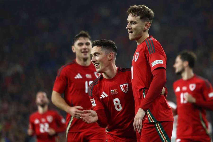 Harry Wilson of Wales celebrates scoring from the spot with David Brooks