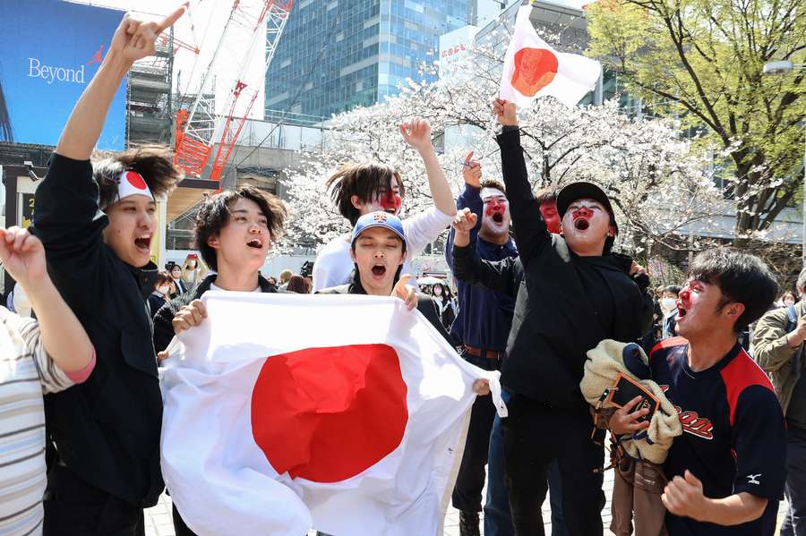 Supporters celebrate Japan's win