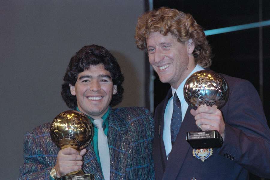 Diego Maradona poses with the Golden Ball alongside Harald Schumacher who received the Silver Ball at the Lido in Paris on November 13, 1986