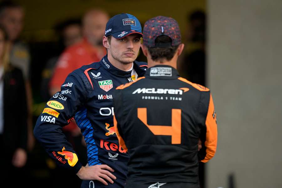 Red Bull's Max Verstappen (L) talks with McLaren's Lando Norris after qualifying for the Mexico City Grand Prix