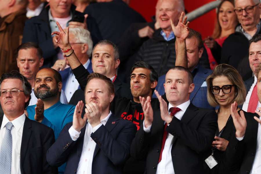 Rishi Sunak, Prime Minister of the United Kingdom, enjoys the pre match atmosphere in the stands