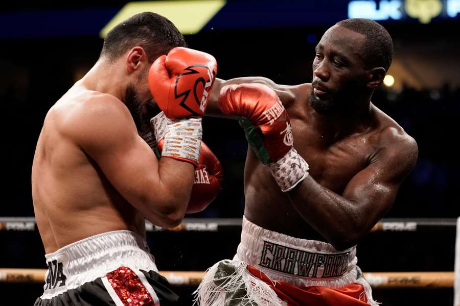 WBO champion Terence Crawford (R) punches David Avanesyan during their welterweight title fight