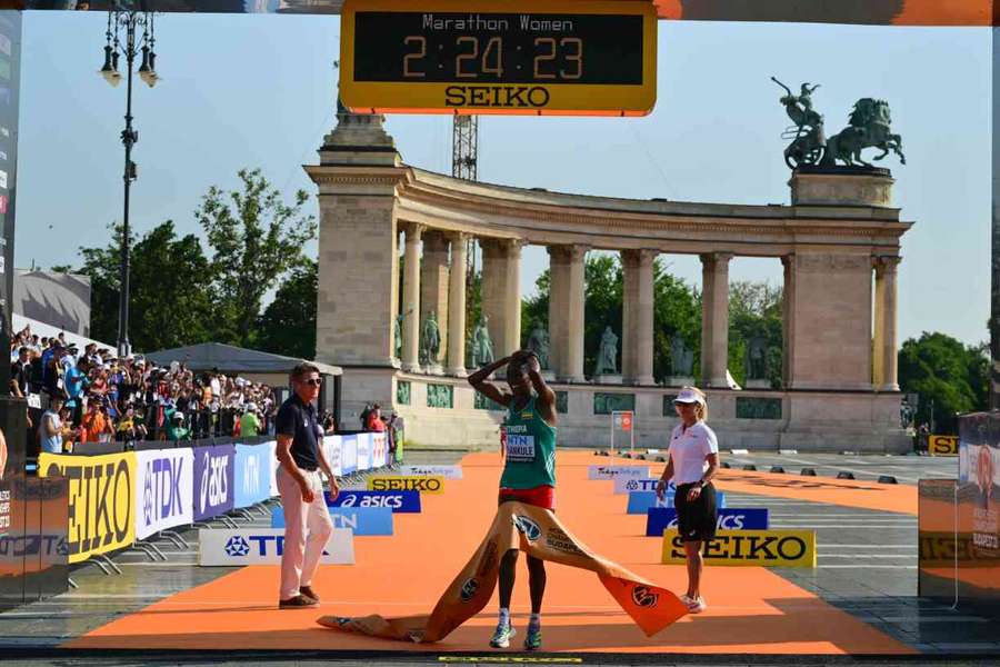 Amane Beriso Shankule celebrates as she crosses the finish line in the marathon Amane Beriso Shankule celebrates as she crosses the finish line in the marathon