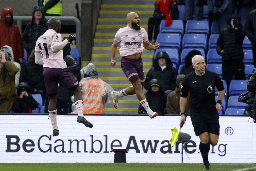 Mbeumo (centre) celebrates another goal