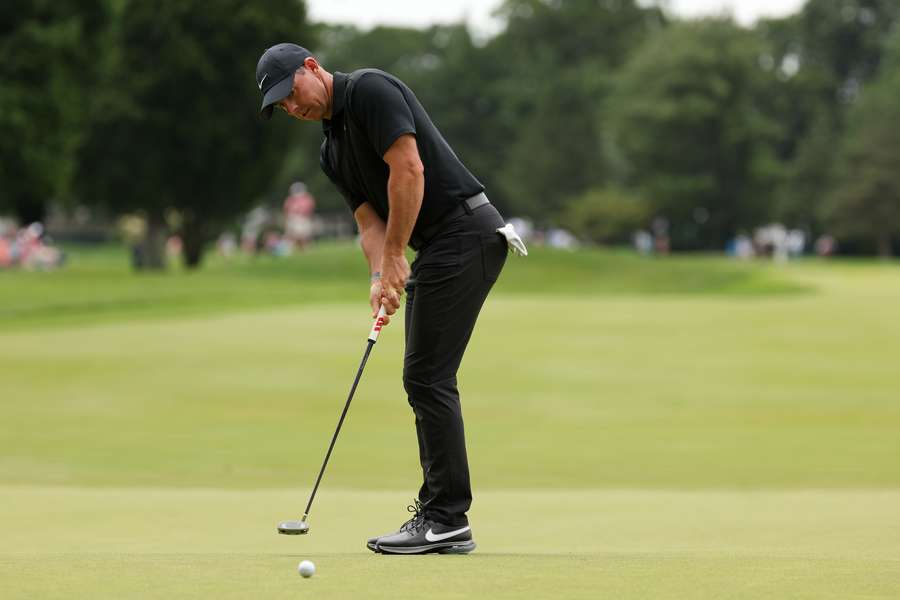 Rory McIlroy putts on the seventh green during the second round
