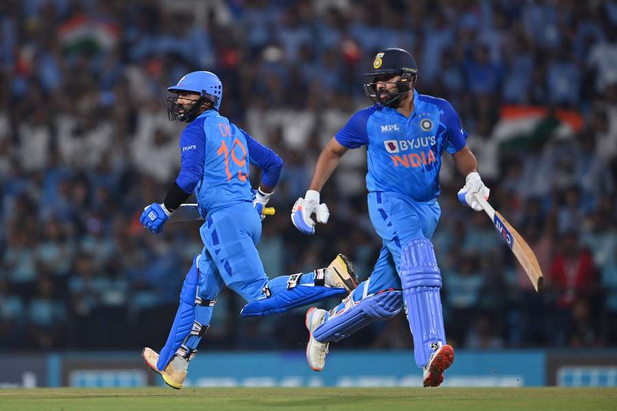 India captain Rohit Sharma (R) and Dinesh Karthik run between the wickets during the second T20 international against Australia.