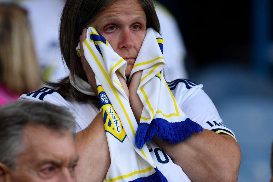 A Leeds fan reacts to the defeat in the crowd after the English Premier League football match between Leeds United and Tottenham Hotspur at Elland Road
