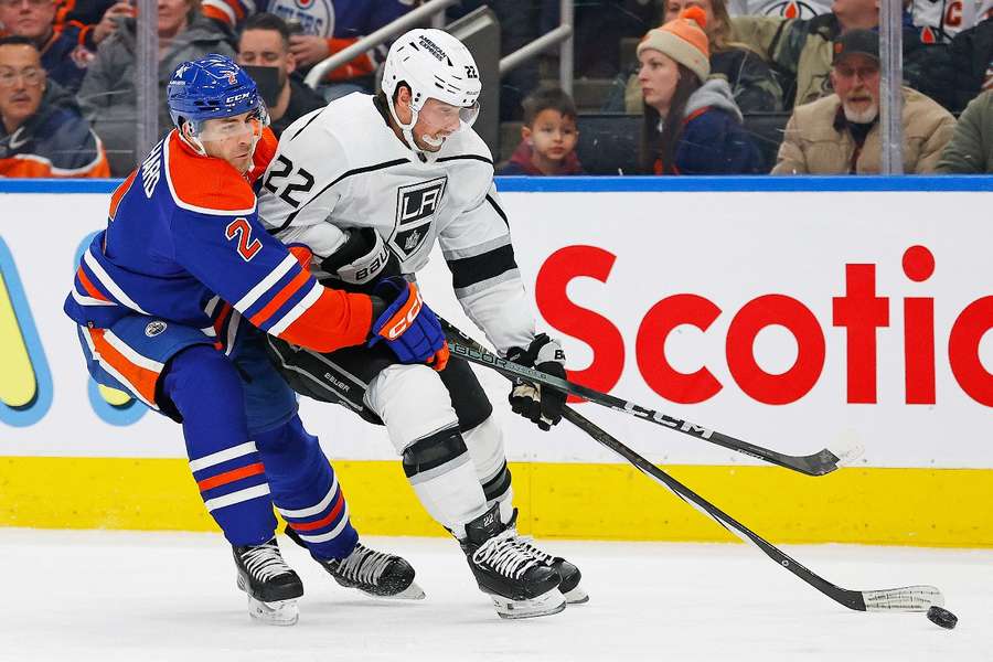 Los Angeles Kings forward Kevin Fiala protects the puck from Edmonton Oilers' Evan Bouchard during the first period at Rogers Place