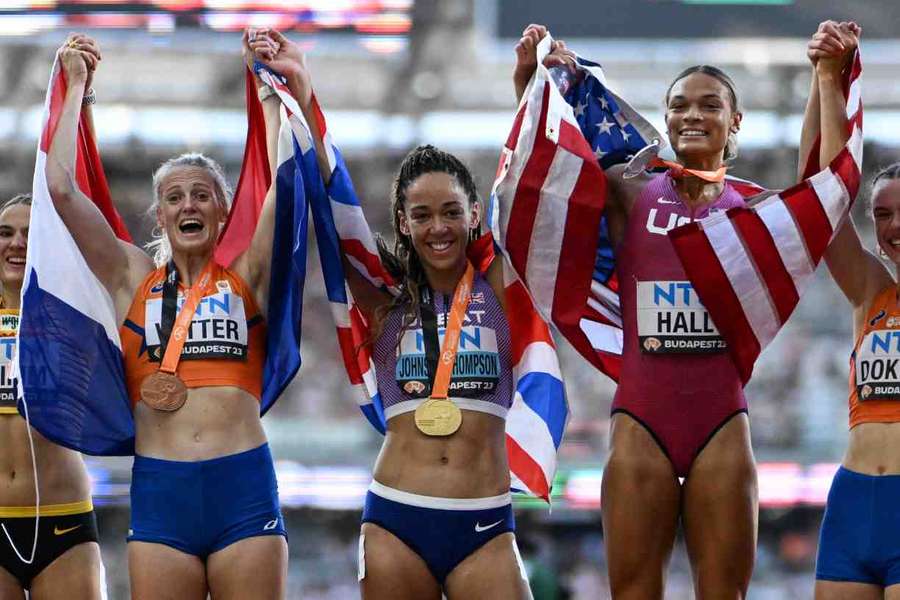 KJT celebrates with her gold medal after winning the heptathlon on a dramatic Sunday