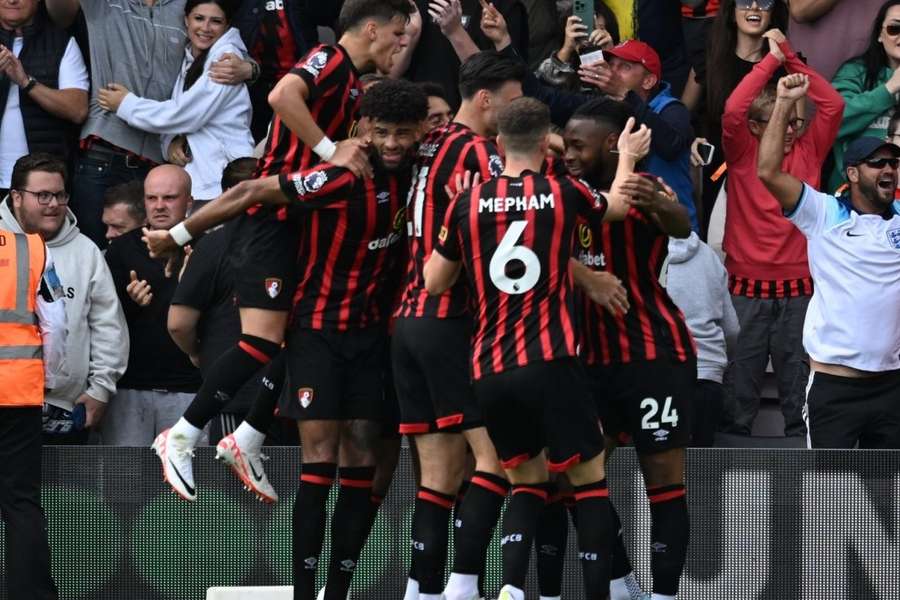 Justin Kluivert celebrates with teammates after scoring Bournemouth's third goal