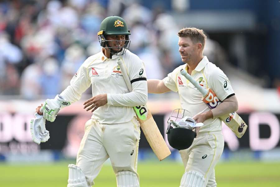 Khawaja and Warner walk off