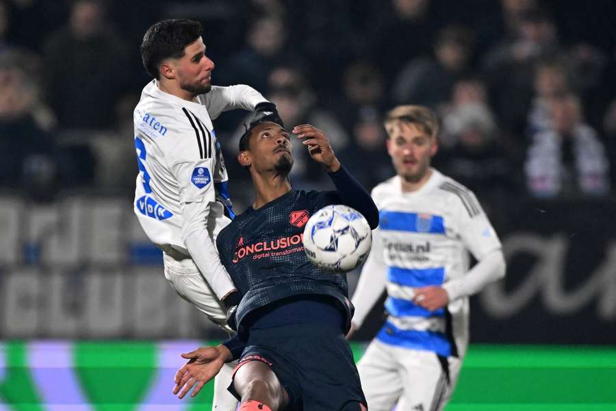 FC Utrecht's Sebastien Haller battling it out with Anouar El Azzouzi of PEC Zwolle