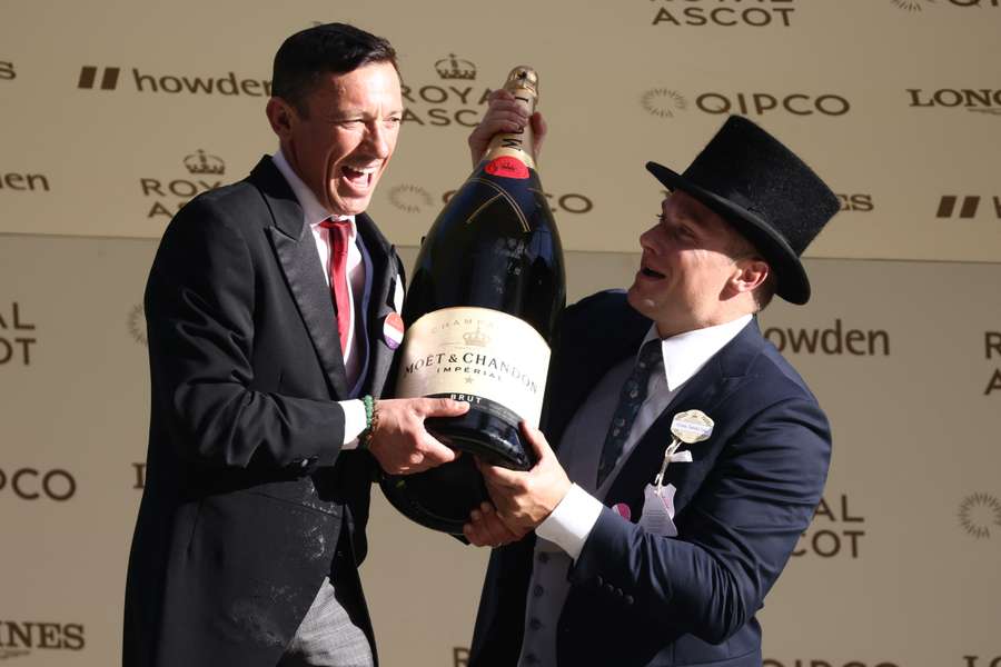 Frankie Dettori is presented with a bottle of champagne after riding Knockbrex in his last Royal Ascot race, The Golden Gates Stakes