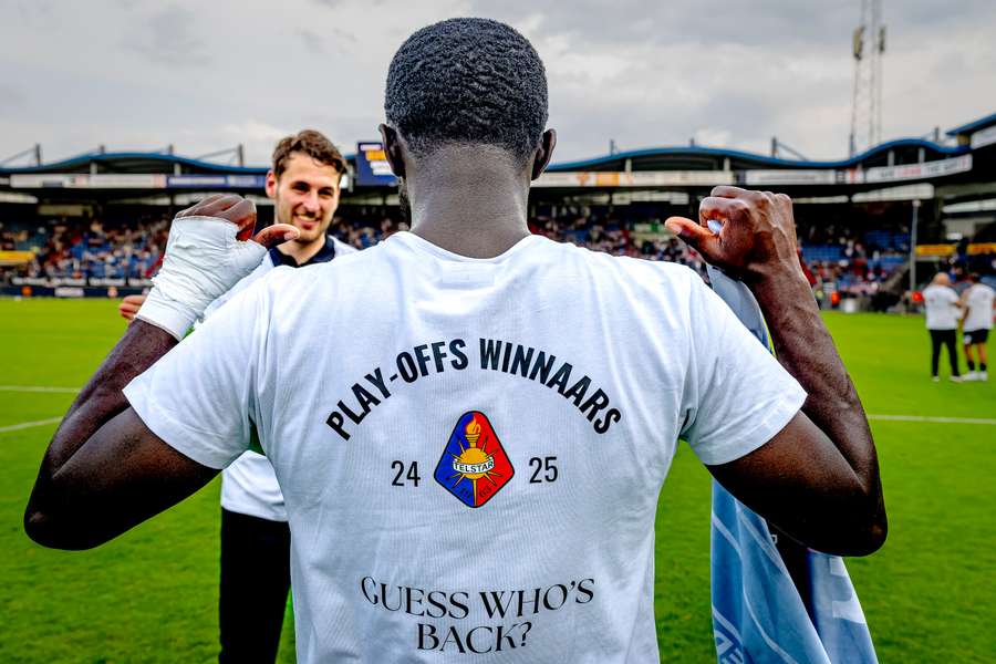 Telstar captain Mitch Apau shows the special shirt for Telstar's promotion