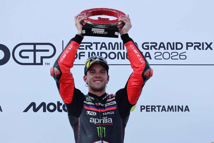 Aprilia's Marco Bezzecchi celebrates on the podium Aprilia's Marco Bezzecchi celebrates on the podium