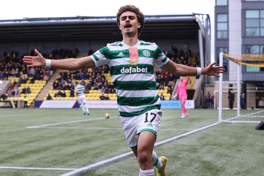 Jota celebrates his goal