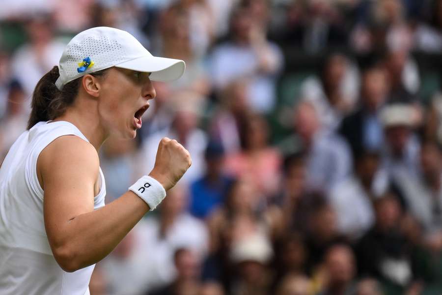 Iga Swiatek celebrates winning a point against Belinda Bencic