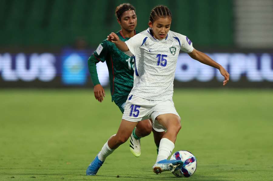 Uzbekistan's Umida Zoirova controls the ball during a group stage game against Bangladesh.