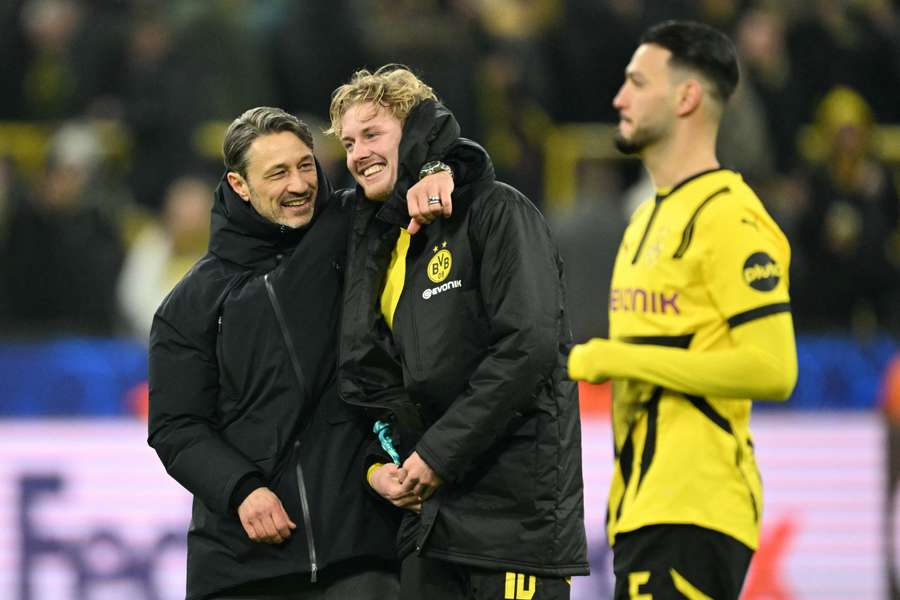 Dortmund's head coach Niko Kovac celebrates with midfielder Julian Brandt after the match