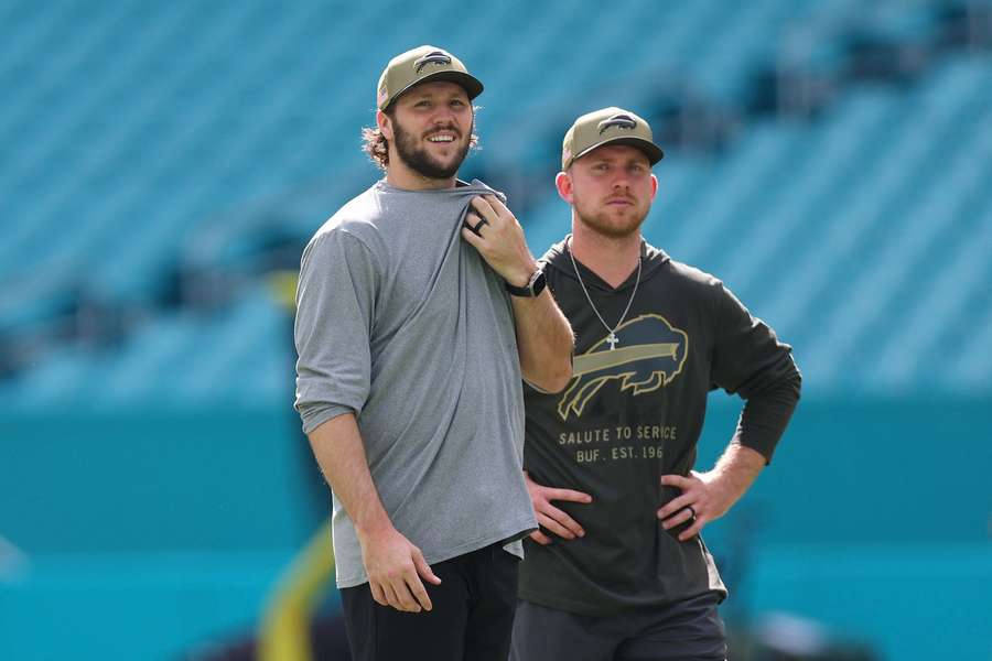 Buffalo Bills QB Josh Allen (L) with head coach to-be Joe Brady during team warmups before the game against the Miami Dolphins