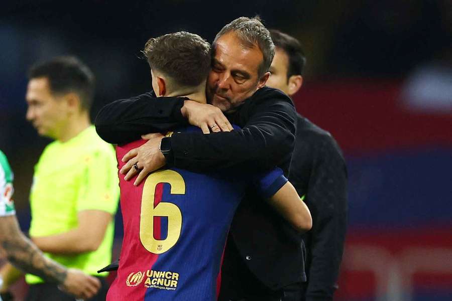 Barcelona coach Hansi Flick embraces Gavi after the team's lone goal against Real Betis