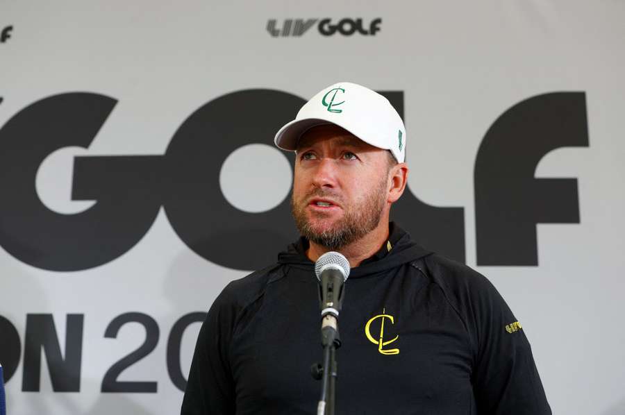 Graeme McDowell talks to the media during a practice round