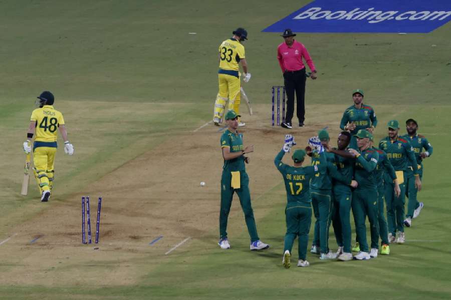 South Africa's Kagiso Rabada celebrates with teammates after taking the wicket of Australia's Josh Inglis