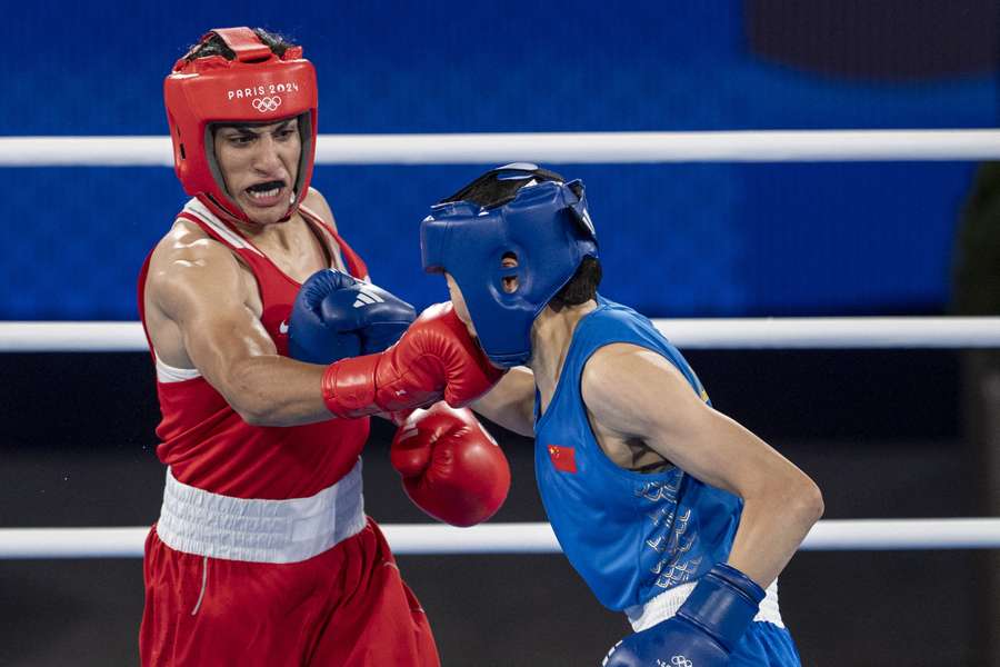 Imane Khelif (red) of Team Algeria competes with Liu Yang (blue) of China