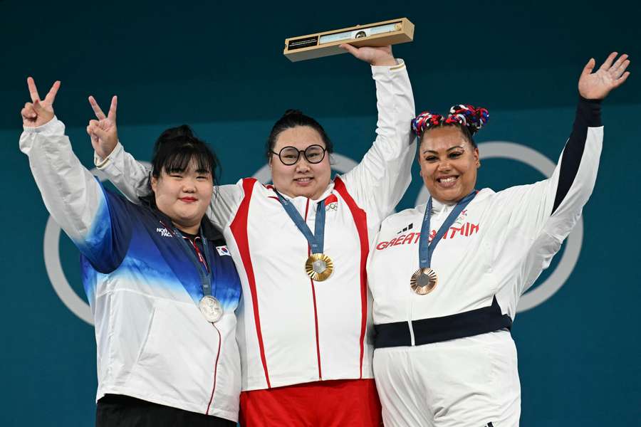 South Korea's silver medallist Hyejeong Park, China's gold medallist Li Wenwen and Britain's bronze medallist Emily Campbell