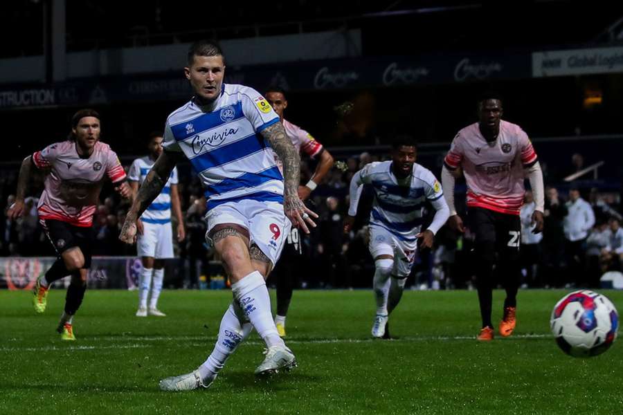 Lyndon Dykes of QPR scores a penalty to make it 2-1