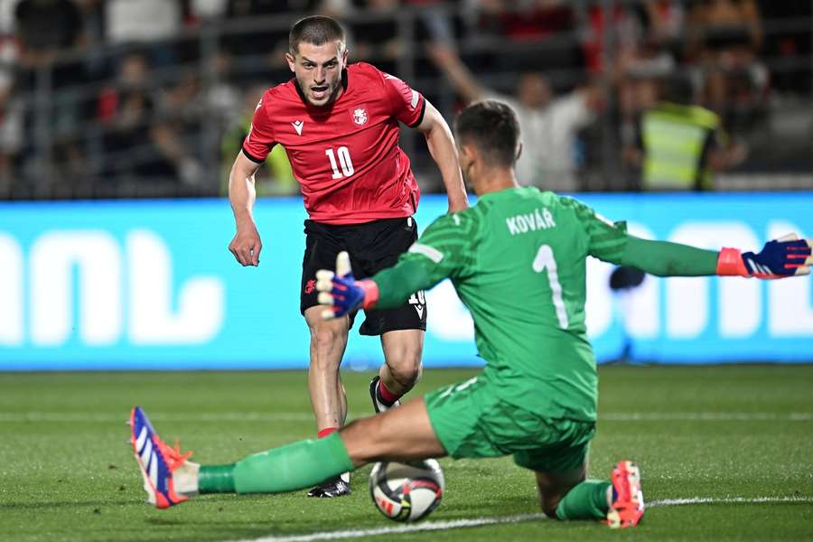 Giorgi Chakvetadze (left) finds the net for Georgia