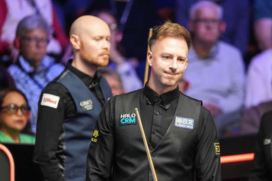 Judd Trump (front) was made to work hard by Gary Wilson (back) throughout the morning session