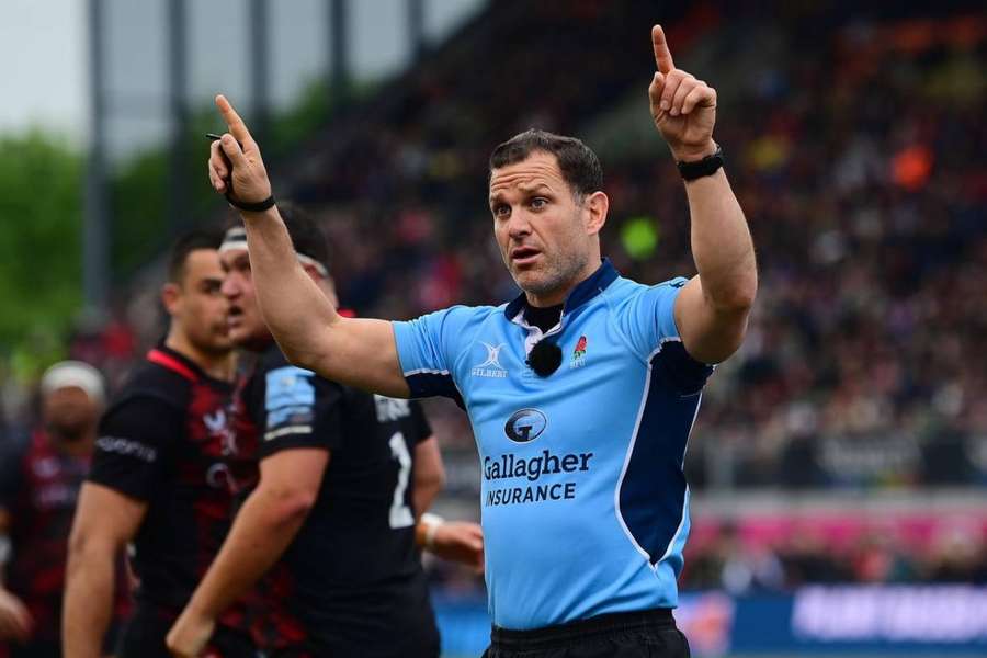 Referee Karl Dickson calls for a TMO review