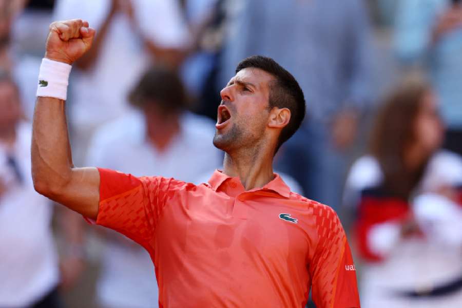 Novak Djokovic celebrates winning the quarter-final