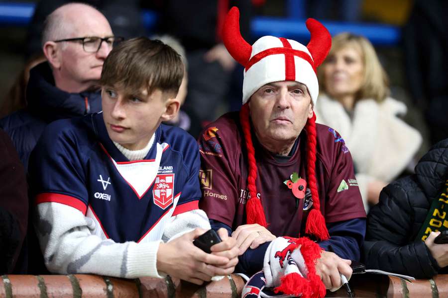 A pair of dejected England fans look on at Headingley Stadium on Saturday night. A pair of dejected England fans look on at Headingley Stadium on Saturday night.
