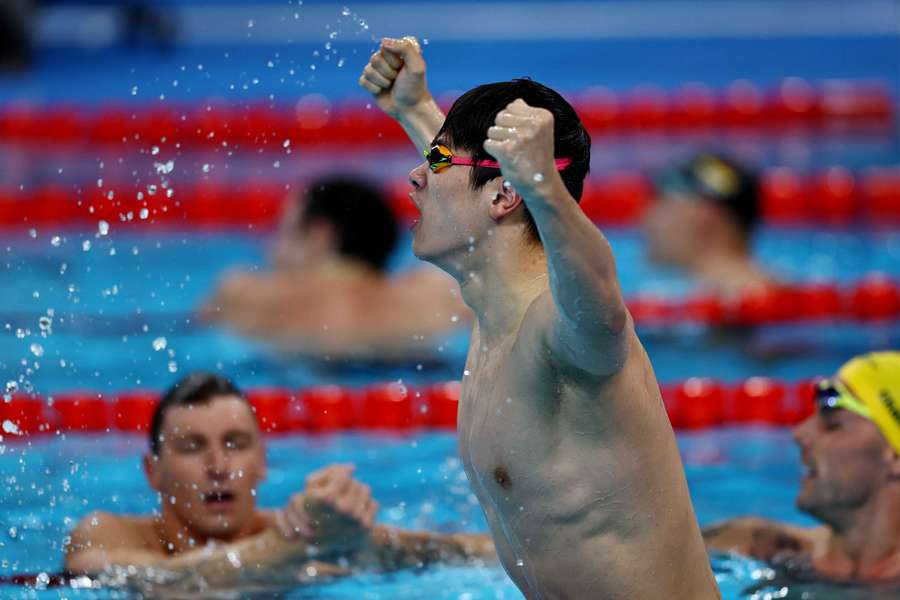 Pan Zhanle of China reacts after winning the race and setting a new world record