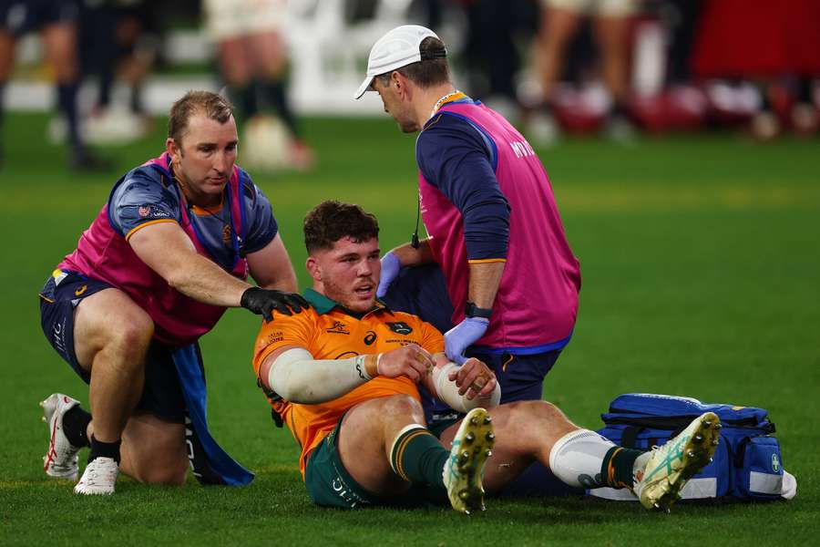 Carlo Tizzano receives medical attention during the final moments of the second Test last weekend.