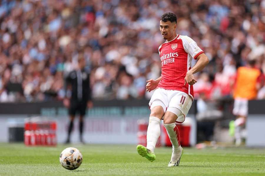 Gabriel Martinelli (L) celebrates with teammates after scoring Arsenal's fourth goal against Crystal Palace