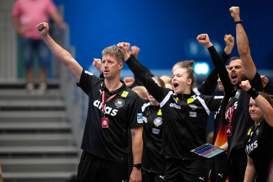 Germany's national coach Markus Gaugisch celebrates during the match against Denmark