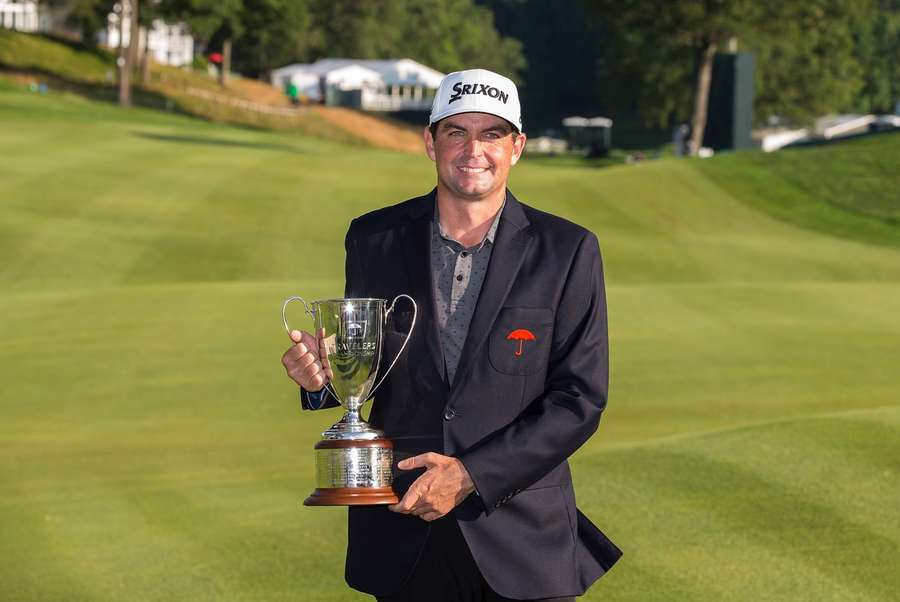 Keegan Bradley holds his trophy