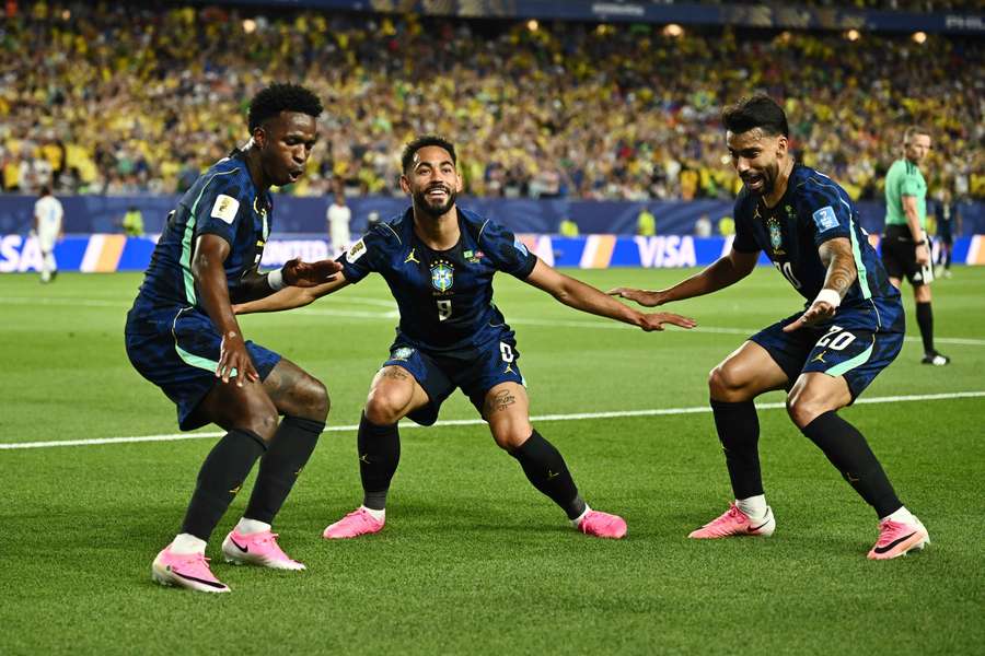 Matheus Cunha celebrates scoring their second goal with Vinicius Junior and Lucas Paqueta
