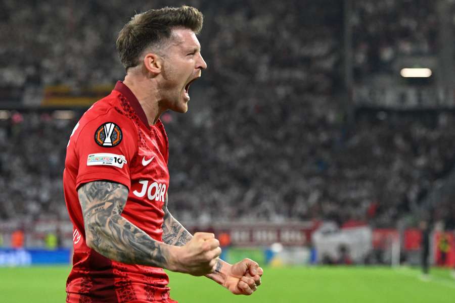 Freiburg's Lukas Kubler celebrates scoring early goal