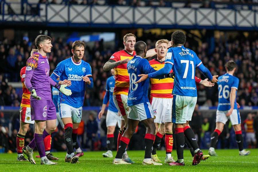 Both teams clash after the controversial incident at Ibrox