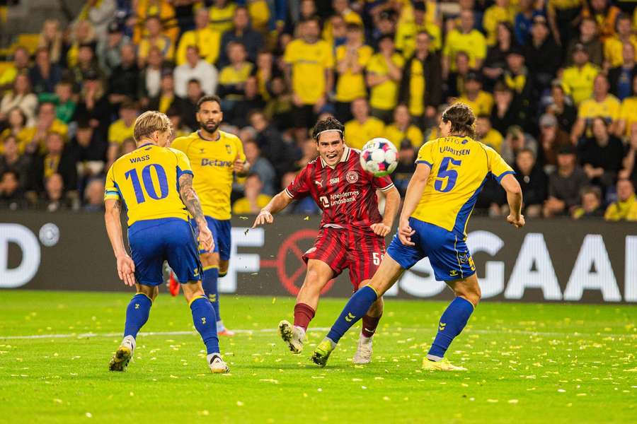 FC Midtjylland's Aral Simsir challenging the Brondby rearguard