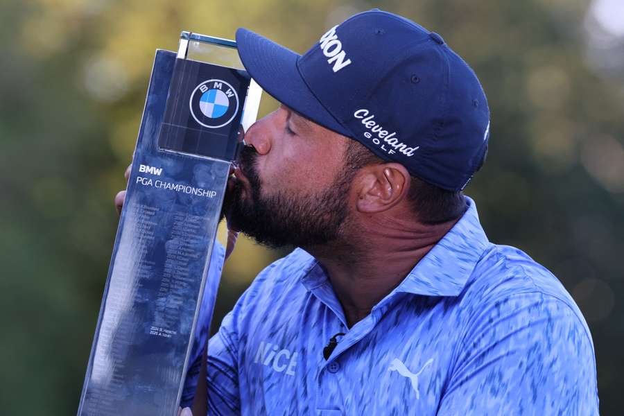 US golfer JJ Spaun kisses the trophy after his victory in the BMW PGA Championship at Wentworth US golfer JJ Spaun kisses the trophy after his victory in the BMW PGA Championship at Wentworth