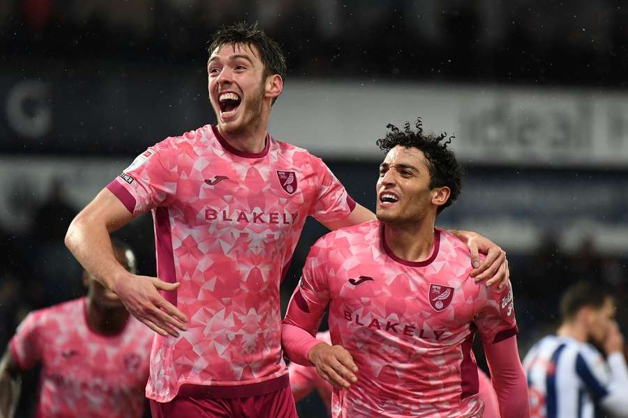 Norwich's players celebrate against West Brom