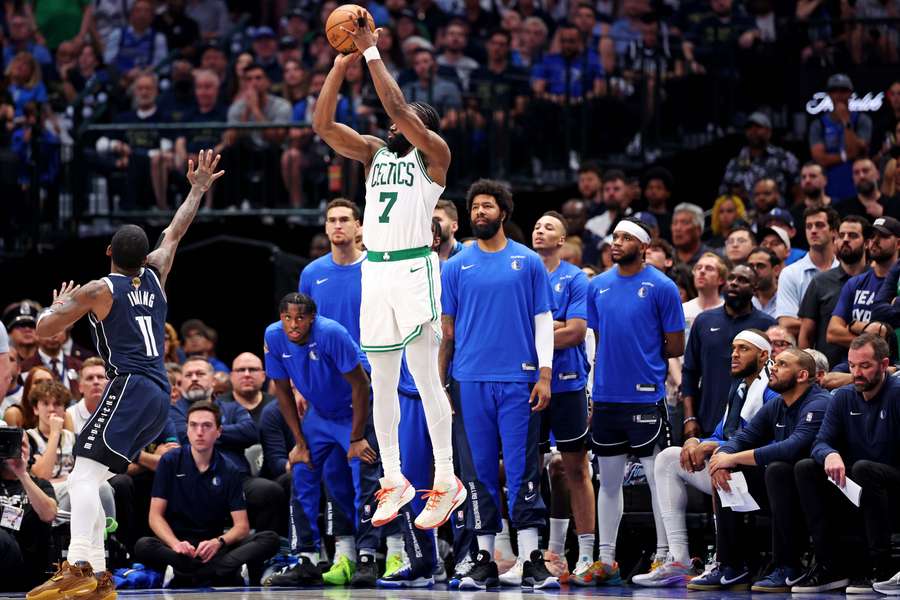Celtics guard Jaylen Brown shoots the ball against Dallas Mavericks' Kyrie Irving during the fourth quarter of Game 3