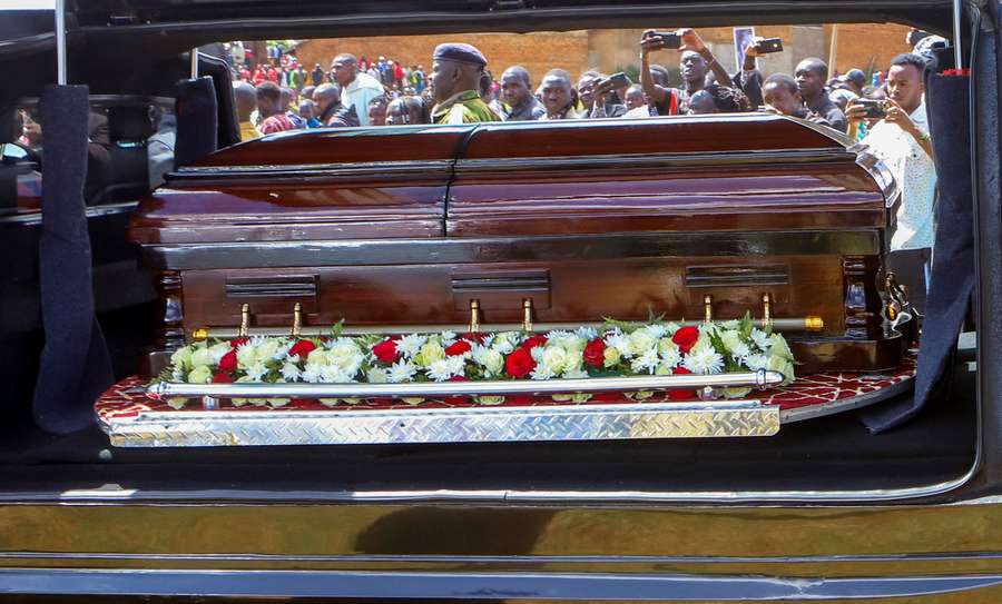 People take pictures of the coffin of Kenya's marathon world record holder Kelvin Kiptum